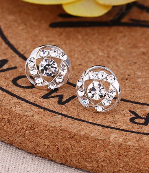 E295 Silver Rhinestone Swirl Earrings - Iris Fashion Jewelry