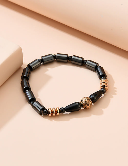 *B930 Black Hematite Magnetic Gold Accent Bracelet - Iris Fashion Jewelry