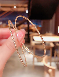 E657 1.9" Gold Textured Hoop Earrings - Iris Fashion Jewelry