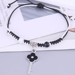 B681 Silver Black & White Cord Flower Key Bracelet - Iris Fashion Jewelry