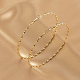 E1664 Gold Twisted Hoop Earrings - Iris Fashion Jewelry