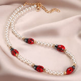 N1975 Gold Pearl Ladybug Necklace with FREE Earrings - Iris Fashion Jewelry