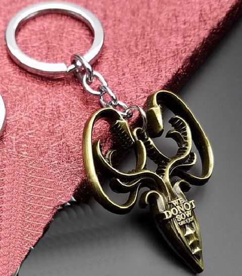 K95 Gold We Do Not Sow Grey Joy Keychain - Iris Fashion Jewelry
